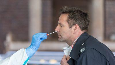 Man receiving a COVID-19 test swab