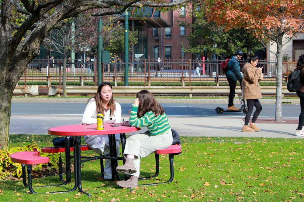 Students spend time on the lawn of the College of Communication. Boston University’s first Belonging and Culture survey revealed that while most people in the BU community feel “comfortable” on campus, members of marginalized groups expressed a lower sense of belonging, according to the survey results. SARAH CRUZ/ DFP PHOTOGRAPHER