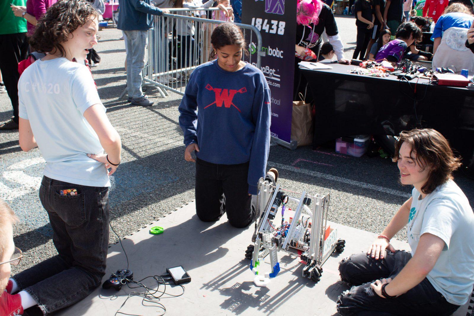 Members of the Winsor Robotics Club hold a robotics demonstration during the Science Carnival, which is part of the Cambridge Science Festival, on Sunday. The festival held over 300 free programs for attendees between Sept. 23-29. SARAH CRUZ/DFP PHOTOGRAPHER