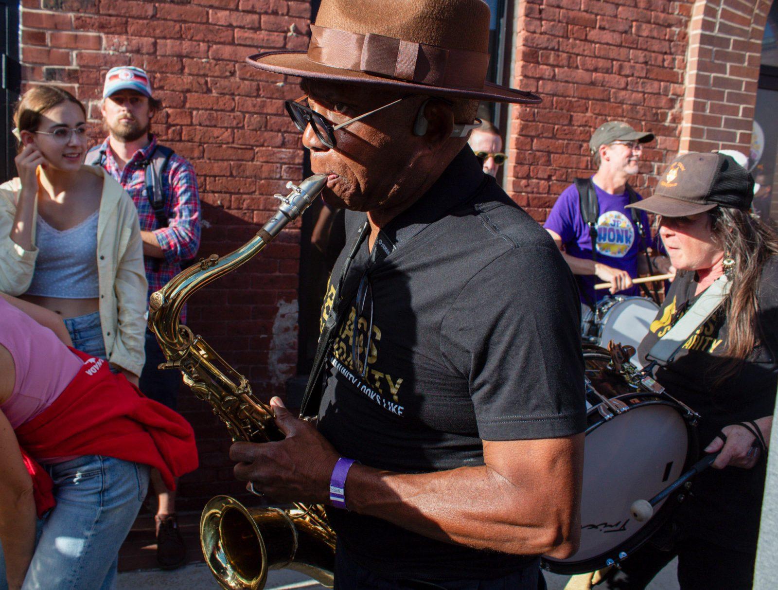 A saxophone player for Brass Solidarity performs at Davis Square on Oct. 5. SARAH CRUZ/DFP PHOTOGRAPHER