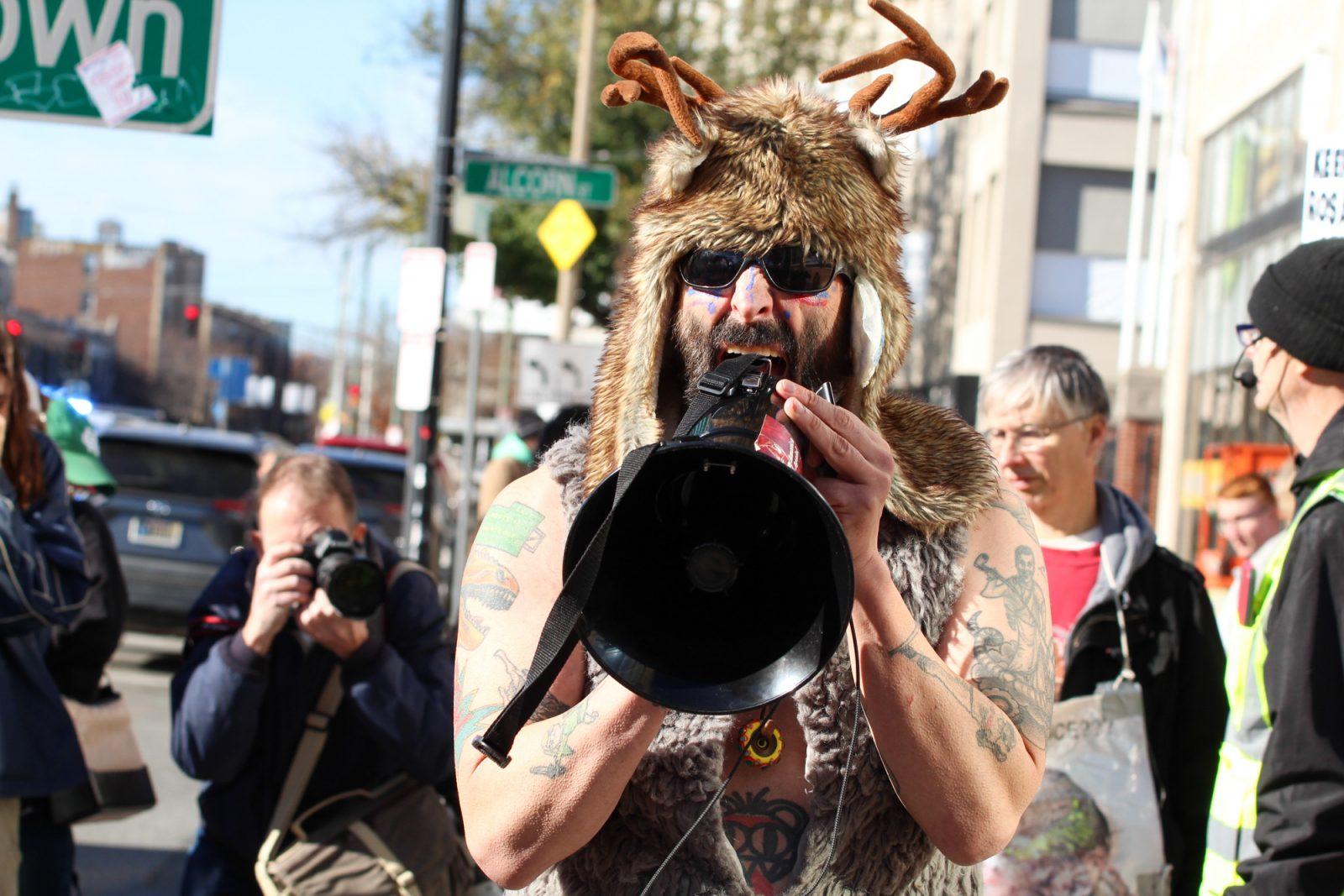 A counter protester mocks participants of the Men’s March by dressing in an animal-like costume and wearing pads under his hat at Planned Parenthood. SARAH CRUZ/DFP PHOTOGRAPHER