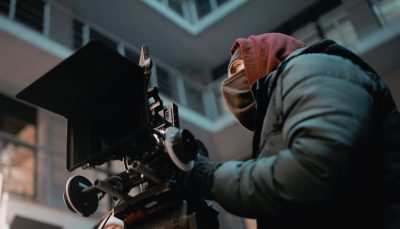 Cameraman wearing a face covering