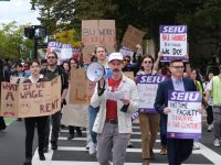 Graduate students, RAs and adjunct faculty members march down Commonwealth Avenue during a three-union rally.