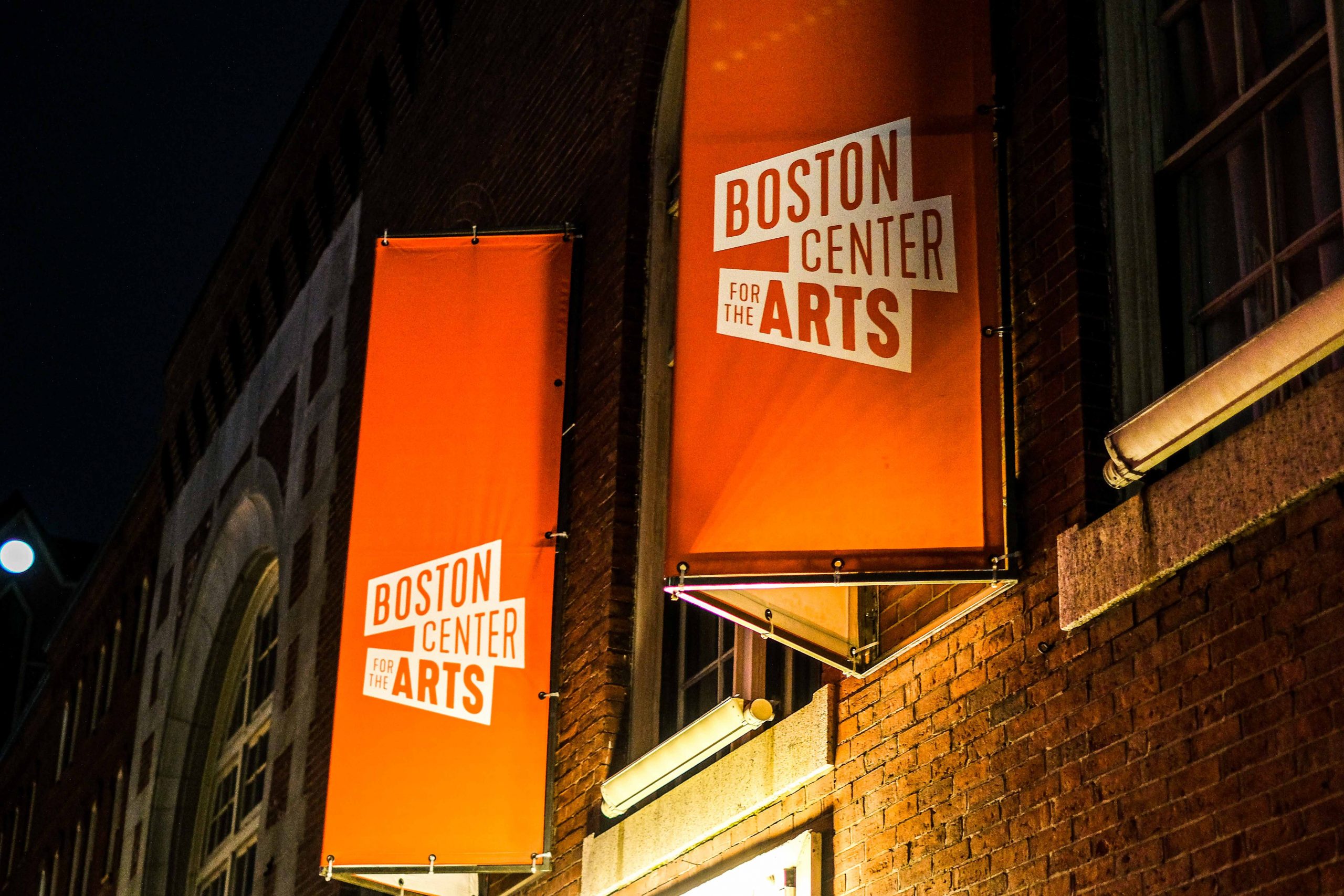 Two signs on the side of building that say "Boston Center for the Arts."
