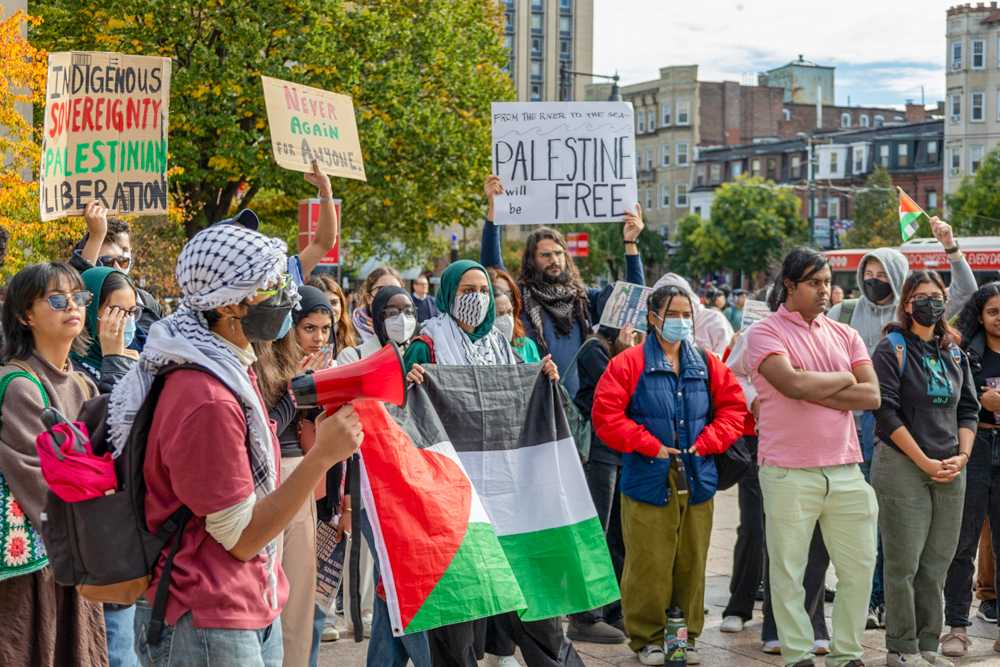 BU Students for Justice in Palestine members and supporters at Marsh Plaza. SJP held a rally to raise awareness for violence against Palestinians in Gaza on Monday. MATTHEW EADIE/DFP STAFF