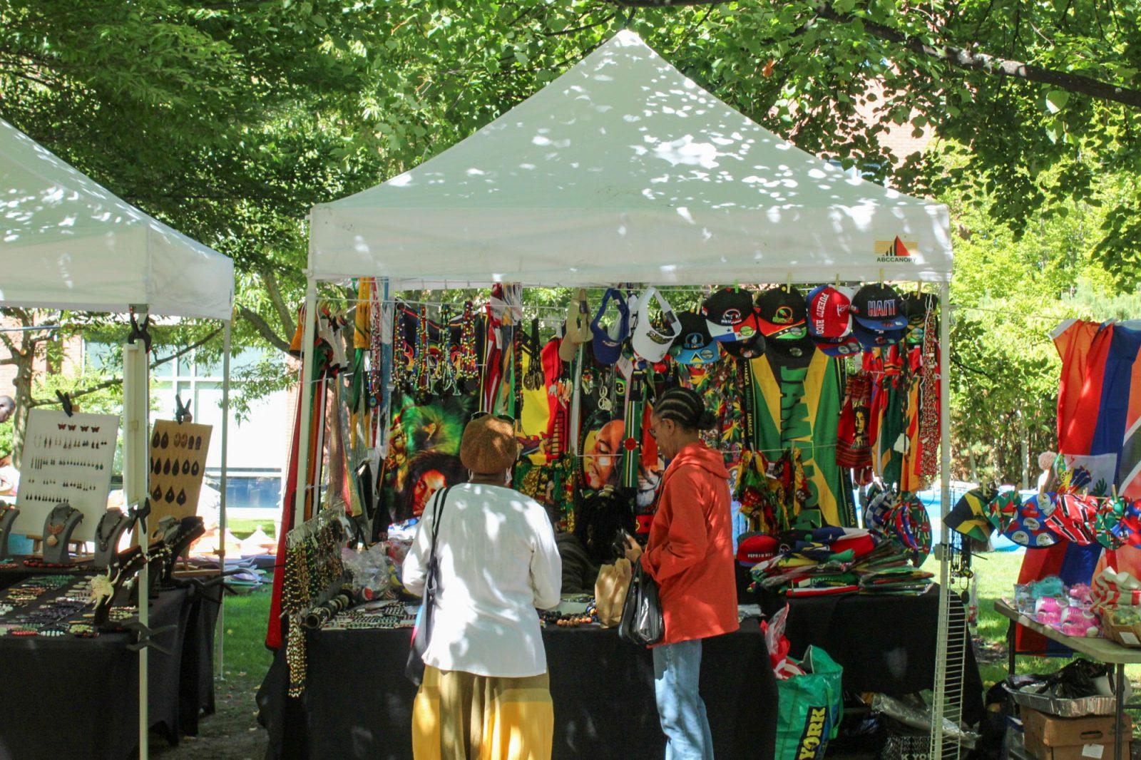 People look at a vendor booth during the Cambridge Carnival International on Sunday. The Cambridge Carnival International is an annual Caribbean style festival celebrating diversity and African and Caribbean culture. ZIBBY ENGLISH/DFP PHOTOGRAPHER 