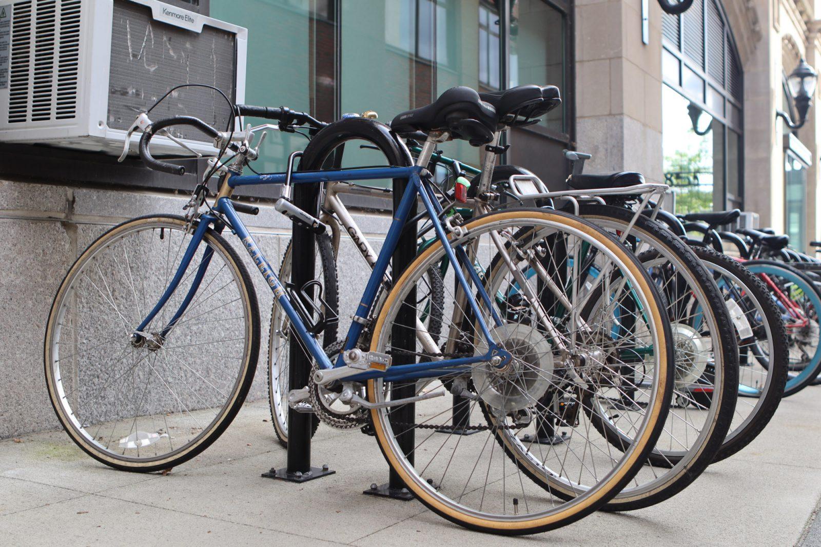Bikes locked to the bike rack outside of the Boston University College of Fine Arts. The Boston University Bridge Safety Alliance is hosting a public meeting with the Boston Transportation Department, the Massachusetts Department of Transportation and the Massachusetts Department of Conservation and Recreation to discuss possible safety improvements to BU Bridge. RACHEL FEINSTEIN/DFP PHOTOGRAPHER 
