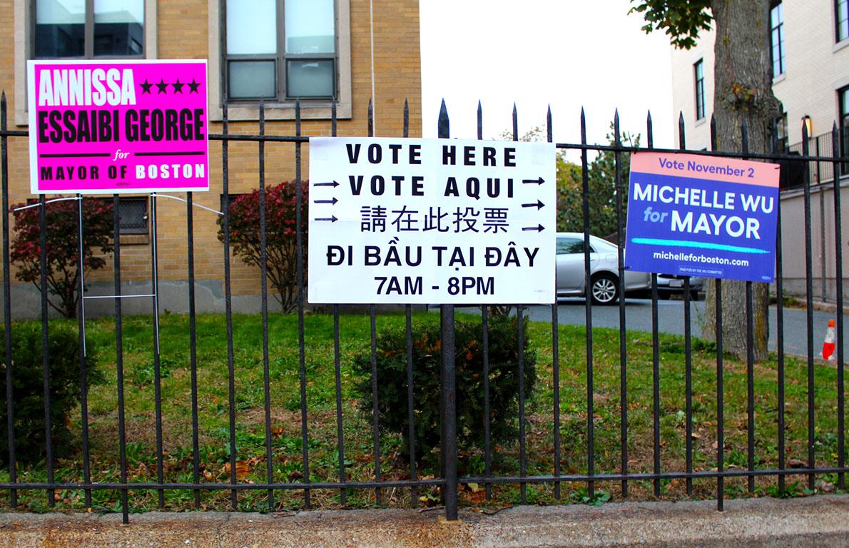A voting sign and campaign posters near the polling site at Tobin Municipal Building. Tuesday’s election will decide Boston’s first elected female mayor of color, with votes rolling in across 255 precincts until 8 p.m.. KATHERINE FEUERMAN/ DAILY FREE PRESS STAFF

