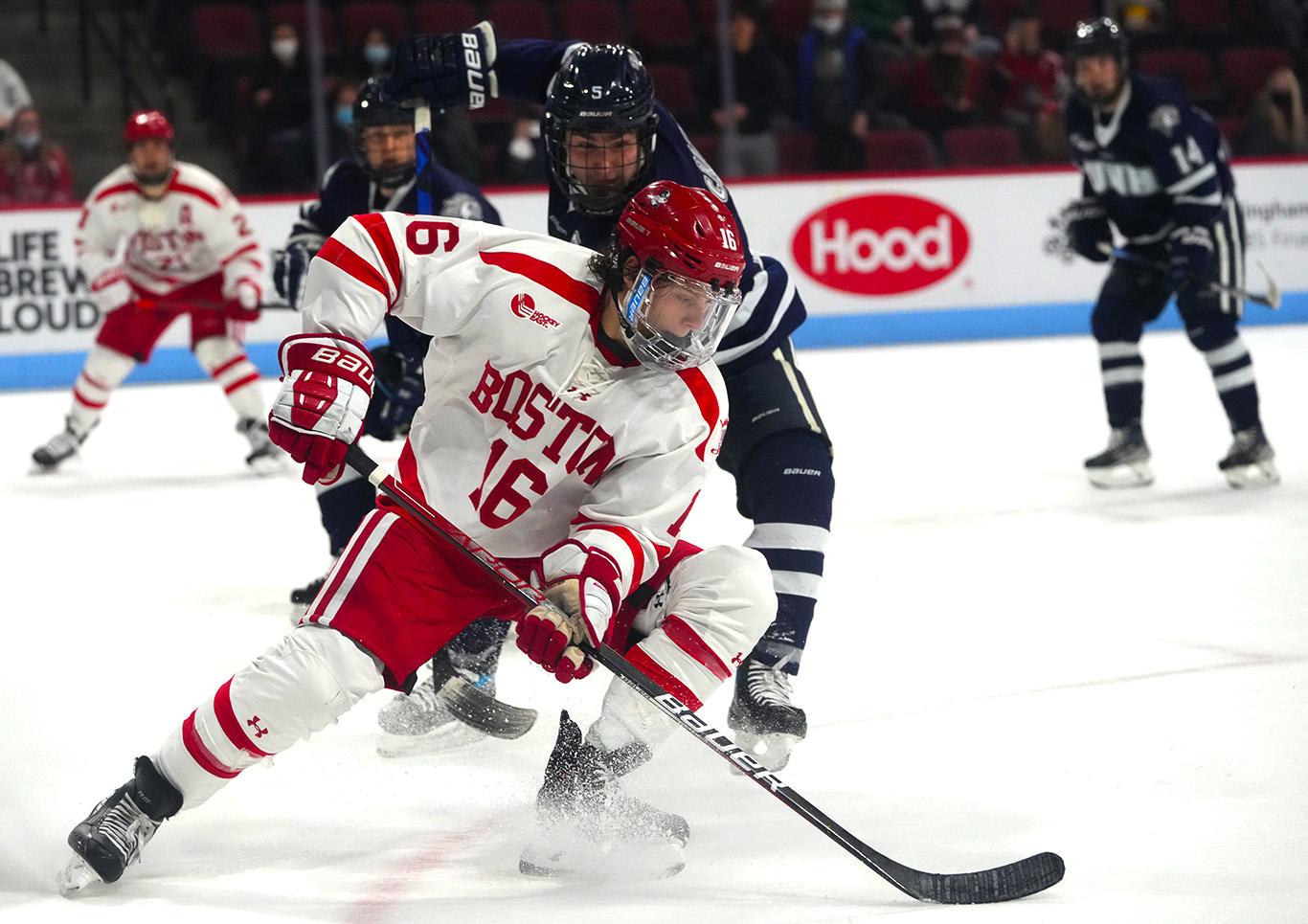 Junior forward Robert Mastrosimone kicks up ice in a hockey match against the University of New Hampshire Friday. The Terriers swept the Wildcats this weekend with a 3-1 win Friday at Agganis Arena and a 2-1 win Saturday in Durham, New Hampshire. MOHAN GE/ DFP STAFF
