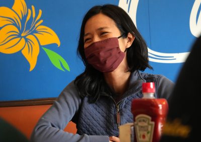 Mayor Michelle Wu sitting at Angela's Cafe