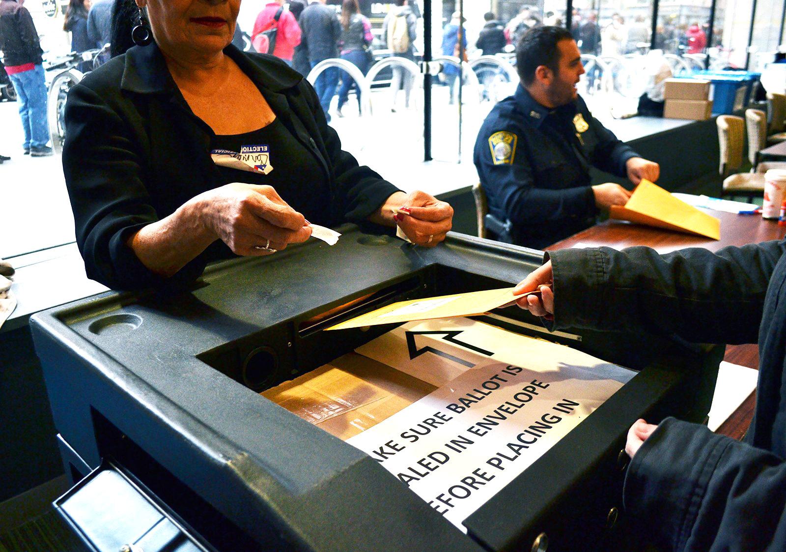 A Boston voter submits their ballot. Mayor Kim Janey challenged the 2020 City of Boston Census count this week following recent research from Boston’s Planning and Development Agency citing the count underreporting the city’s student, incarcerated and foreign-born residents. CHLOE GRINBERG/ DFP FILE
