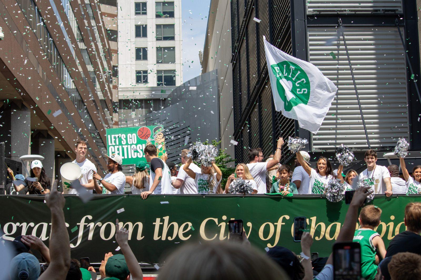 Parade participants cheer from a duck boat on Causeway Street. HOLLY GUSTAVSEN/DFP PHOTOGRAPHER