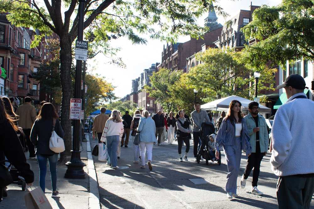 People walk through open Newbury Street. The initiative ended this weekend after 16 consecutive Sundays. HOLLY GUSTAVSEN/DFP PHOTOGRAPHER