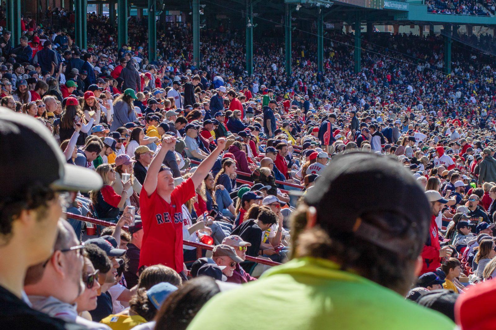 Fans at Fenway Park on the Red Sox Opening Day in April. The Student 9s program, a special discount offered to college students looking to attend Red Sox games, reduces the ticket price to $9 for any student registered with the program. HOLLY GUSTAVSEN/DFP PHOTOGRAPHER