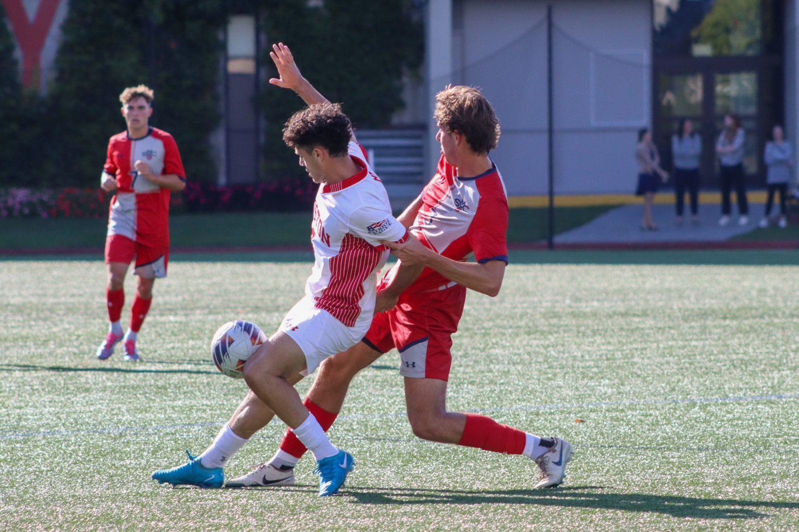 Sophomore forward Andrea Di Blasio (7) protects the ball from a St. Mary’s College of California player during the game on Sept. 5. The men’s soccer team won their first game of the season on Saturday in a match against Army West Point. LILY HANSEN/DFP PHOTOGRAPHER 