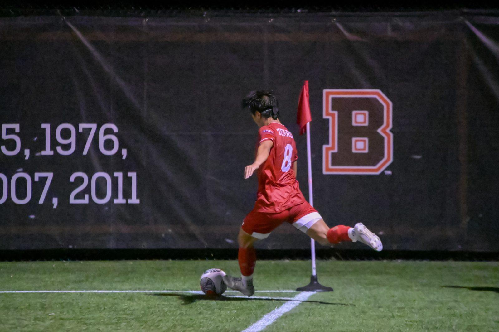 Senior midfielder Daniel Kim (8) takes a corner kick during the men’s soccer game against Brown University. The Terriers fell to Brown University 5-1 in Rhode Island on Tuesday. BELLA JONES/DFP PHOTOGRAPHER
