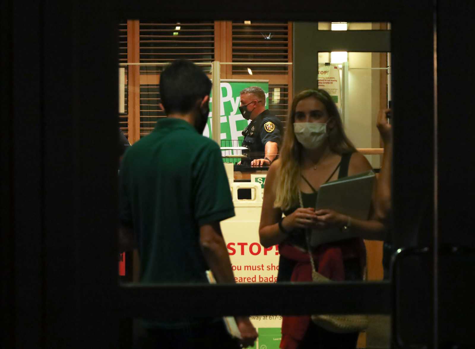 Officials speaking inside 10 Buick St. — StuVi-1 — Monday night. Several floors of the residence were evacuated for several hours after a fire on the east tower’s seventh floor set off sprinklers and fire alarms around 7:46 p.m. CONOR KELLEY/ DAILY FREE PRESS STAFF
