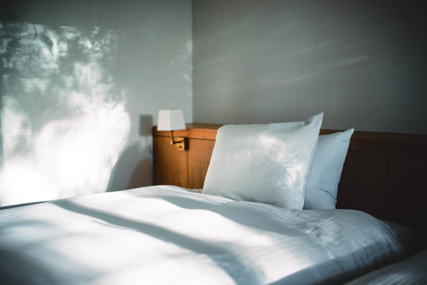 A made bed. Veronica questions the reasons behind why so many people insist on routinely making their bed. COURTESY OF HIROSHI KIMURA VIA UNSPLASH