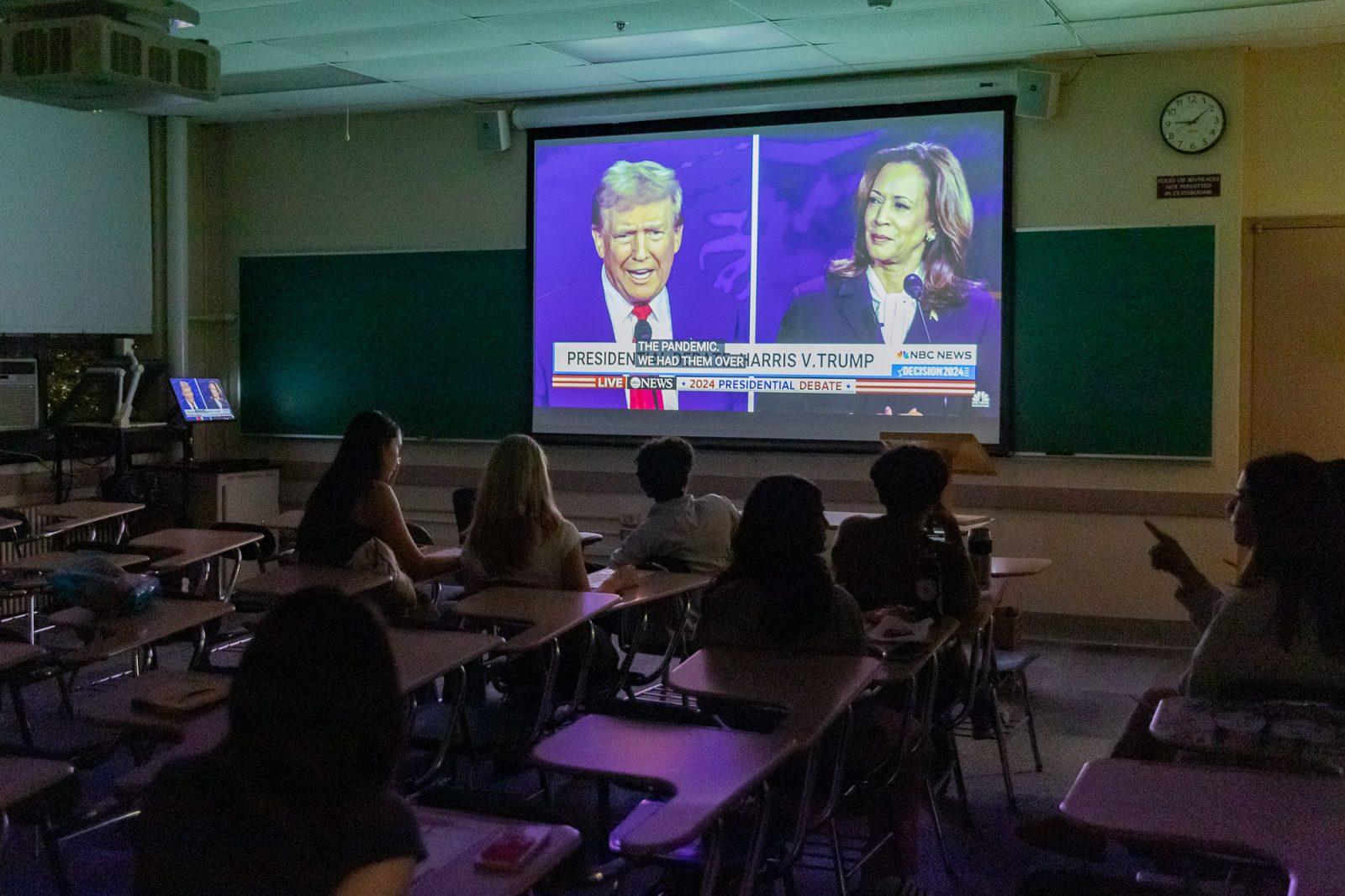 BridgeBU members watch the 2024 presidential debate on Tuesday. People gathered in college classrooms, restaurants and bars to watch the debate. KATE KOTLYAR/DFP PHOTOGRAPHER
