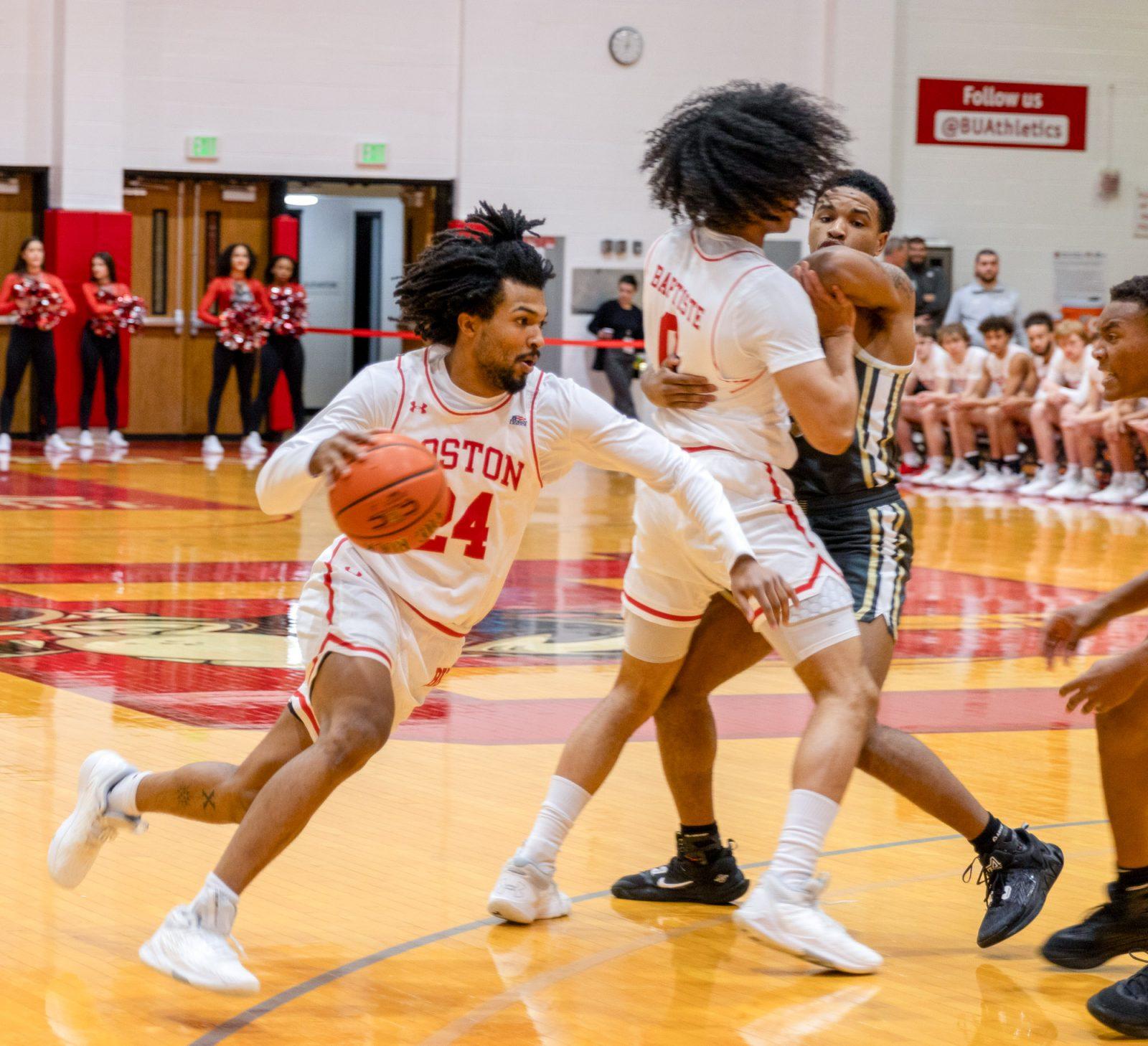 Senior guard Miles Brewster (24) drives to the basket in a game against Army West Point on Wednesday. The Terriers were defeated by the Black Knights 69-59. KATE KOTLYAR/ DFP PHOTOGRAPHER