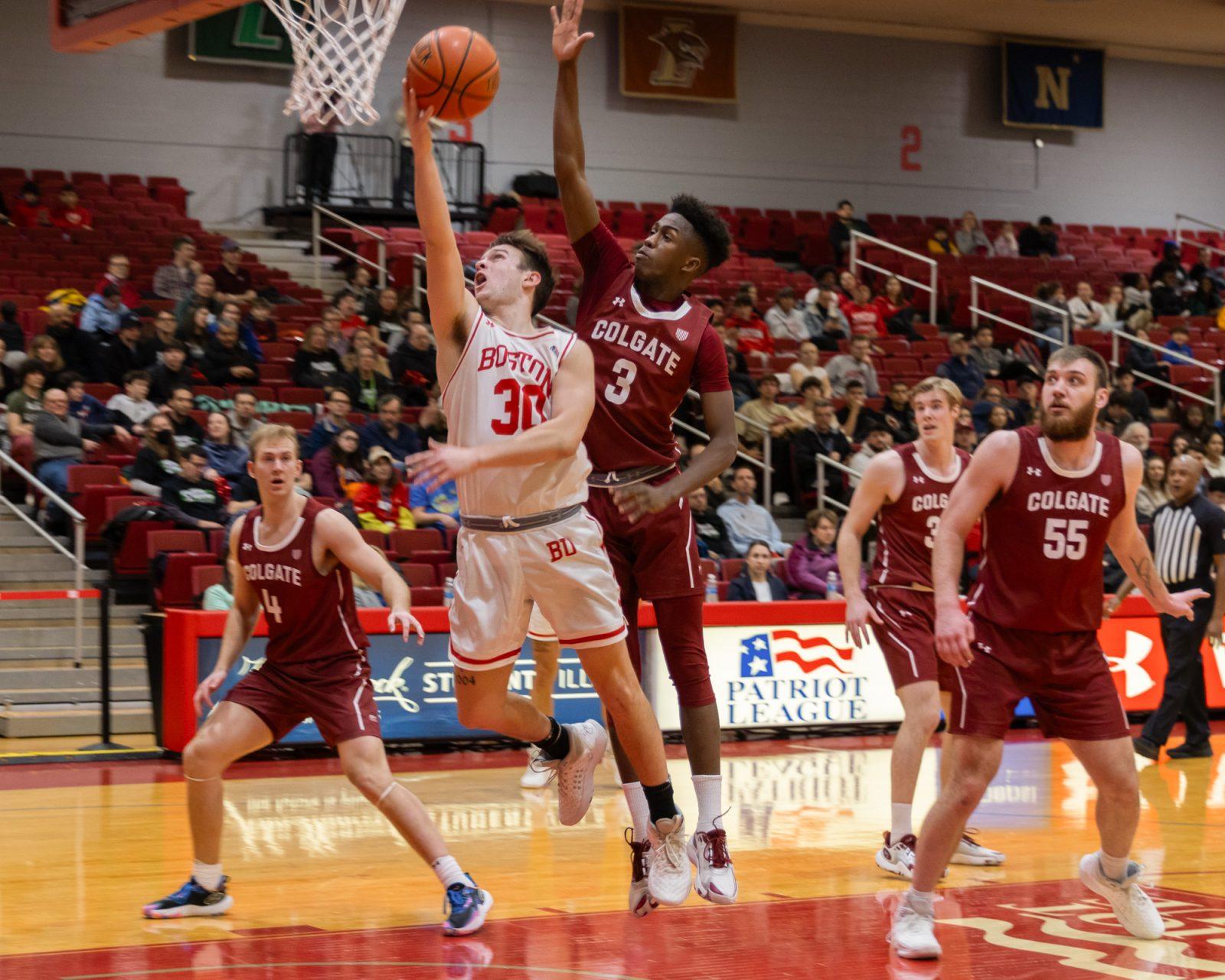 Sophomore guard Ben Roy (30) goes for a layup in a game against Colgate University on Wednesday. The Terriers lost 64-74. KATE KOTLYAR/DFP PHOTOGRAPHER