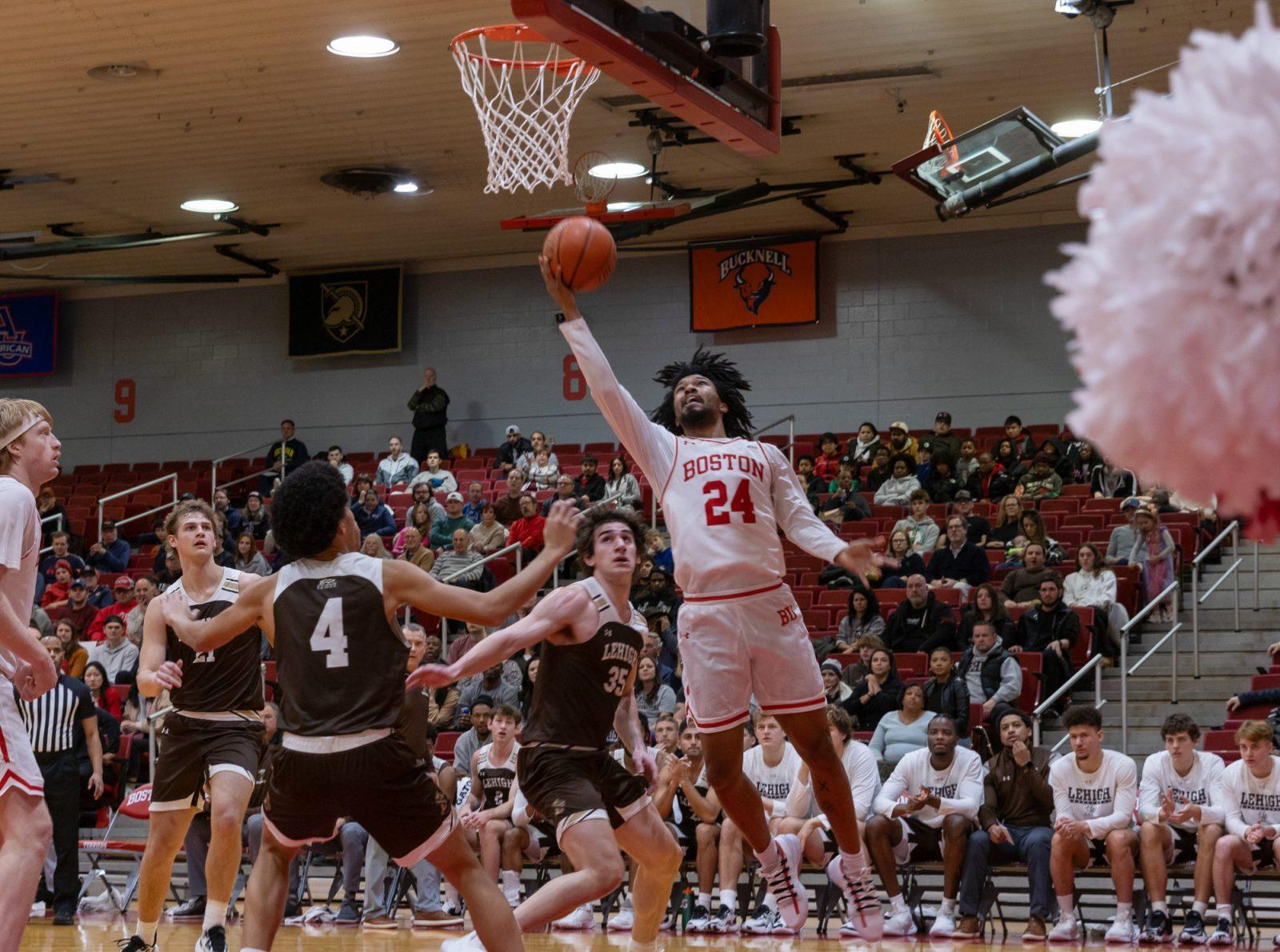 Senior guard Miles Brewster (24) jumps and scores a basket in Saturday’s game against Lehigh University. KATE KOTLYAR/DFP PHOTOGRAPHER