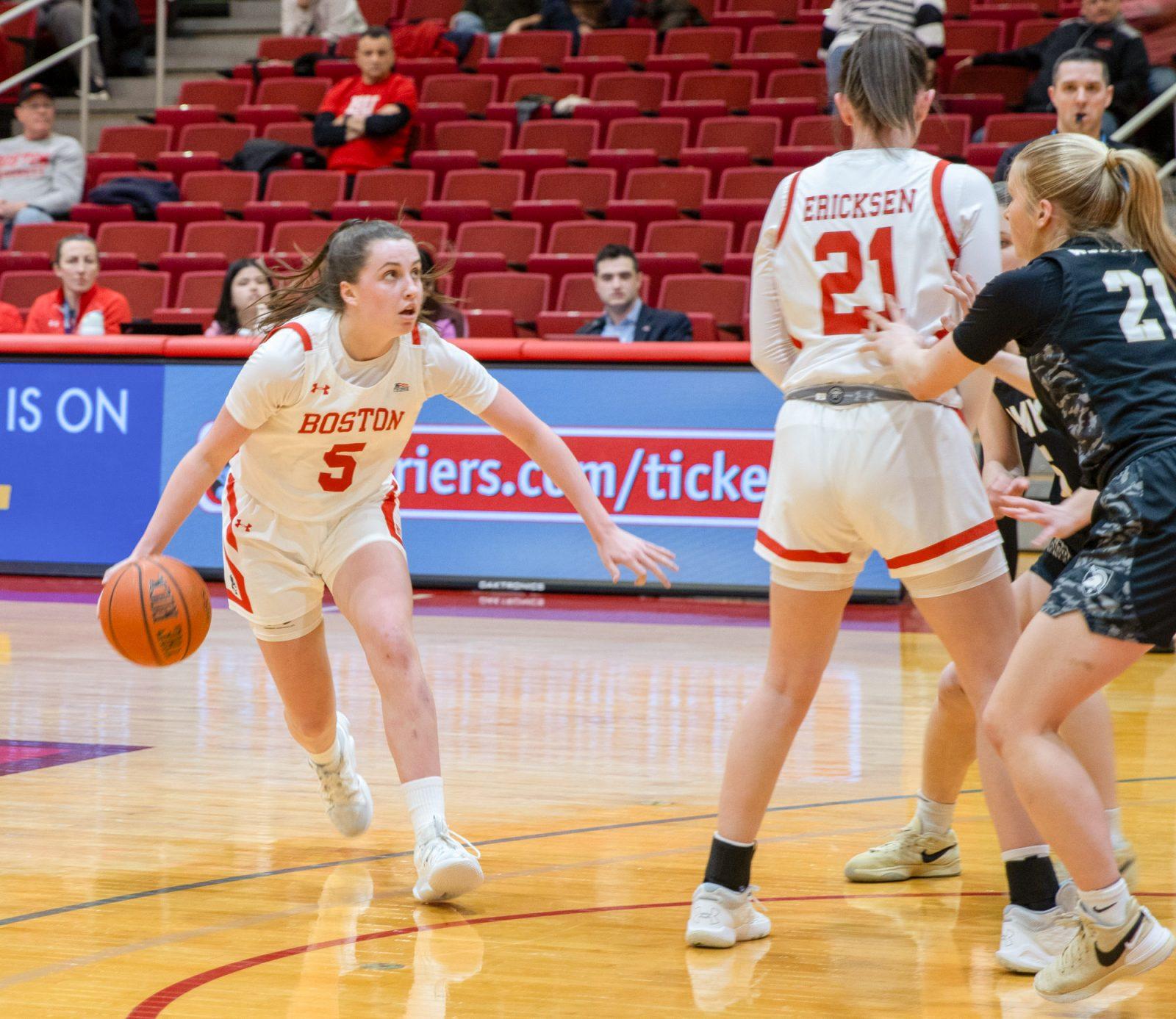 Freshman guard Aoibhe Gormley (5) dribbles the ball in a game against Army on Feb. 14. The Terrier’s came back from a 9-point deficit in the fourth quarter to beat American 58-56 on Wednesday. KATE KOTLYAR/ DFP PHOTOGRAPHER