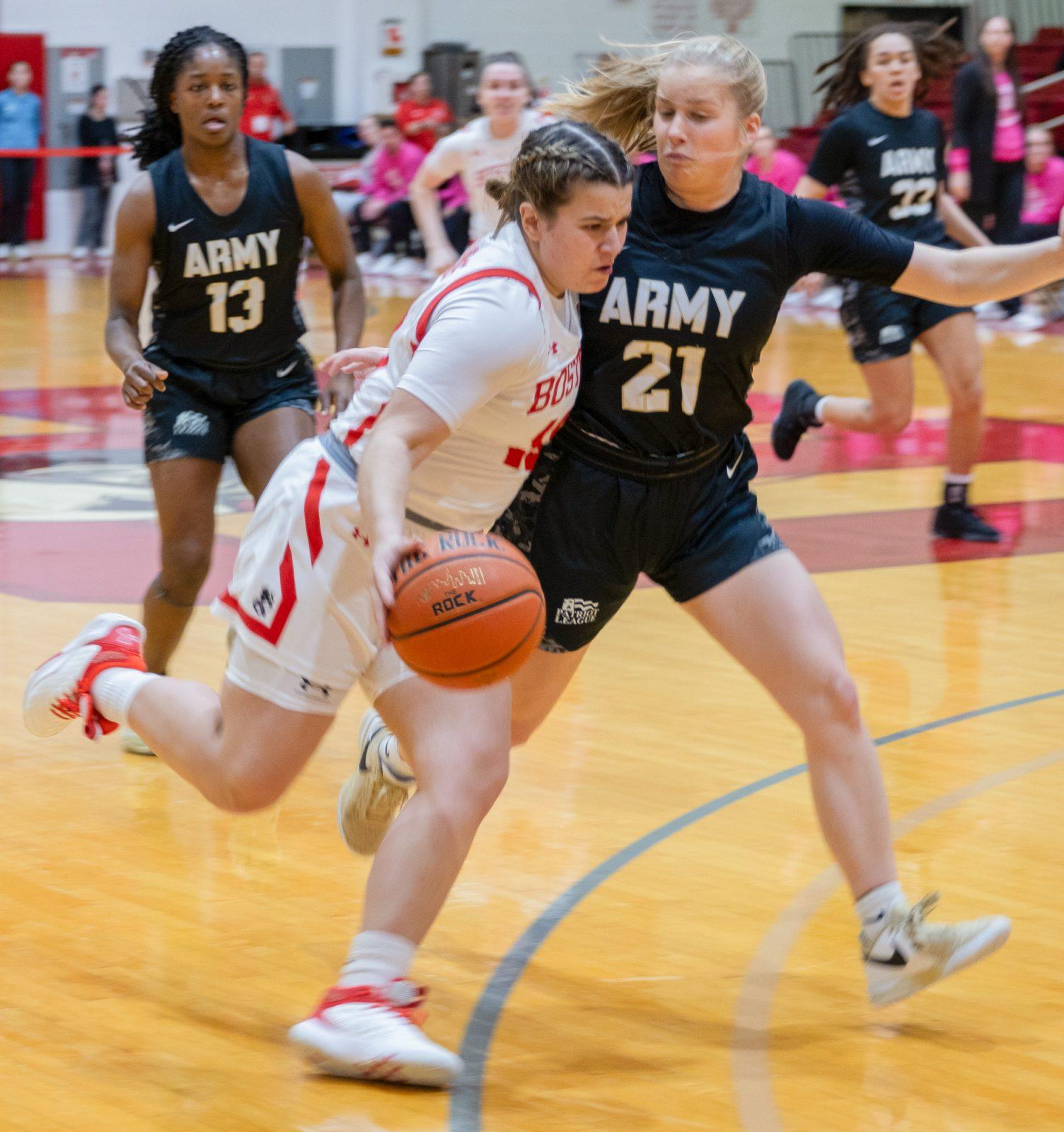 Junior guard Alex Giannaros (10) dribbles the ball down the court in a game against Army on Feb. 14. The Terriers fell to Holy Cross 61-55 in the Patriot League final on Thursday. KATE KOTLYAR/DFP PHOTOGRAPHER