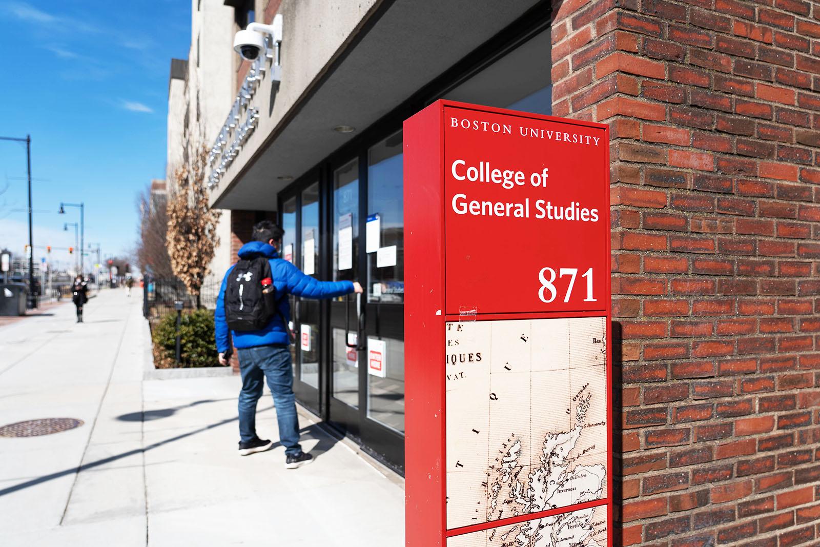 student walking into the college of general studies