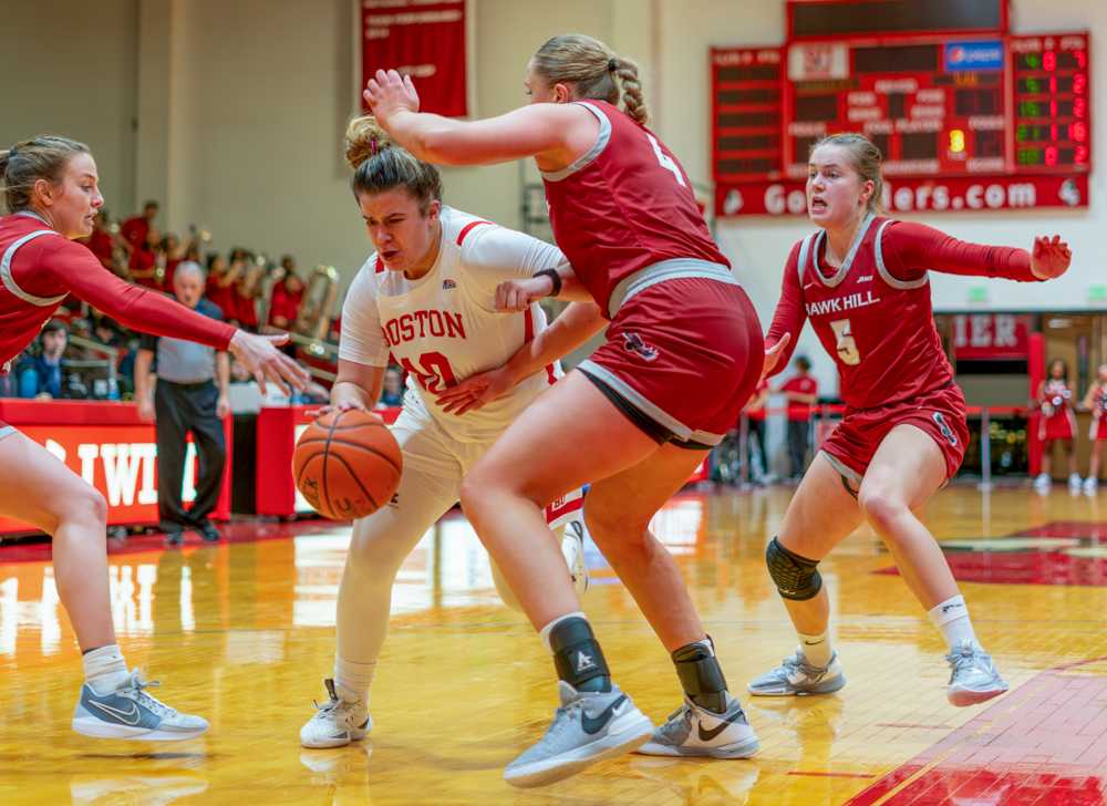 Junior guard Alex Giannaros (10) fights for control of the ball against Saint Joseph’s University on Tuesday. The Terriers fell short 62-47 in their first home loss of the season. HUI-EN LIN/DFP PHOTOGRAPHER