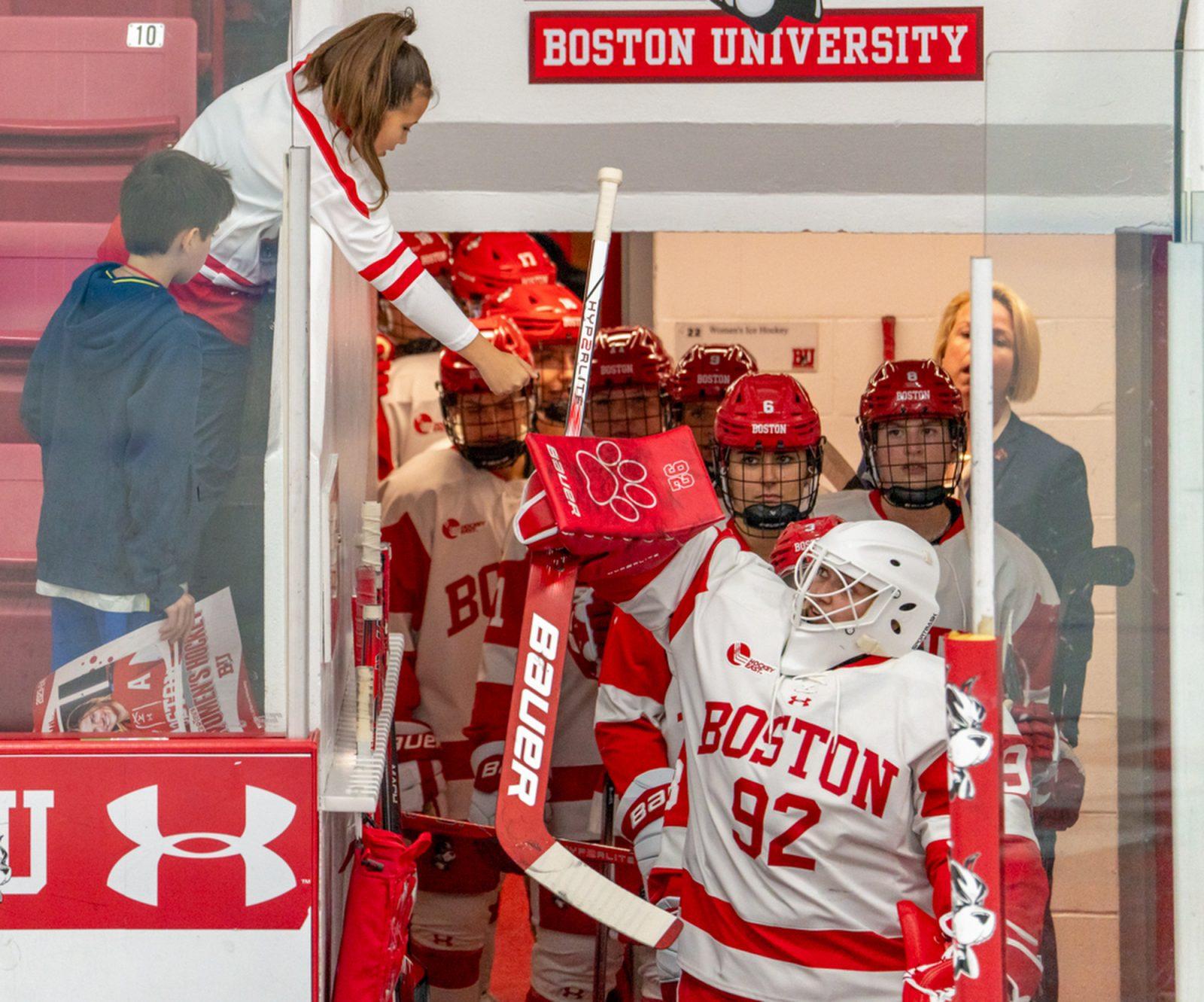 Boston University freshman goaltender Mari Pietersen (92) fist-bumps a fan before an Oct. 6 game against Northeastern. The team has four games over winter break. HUI-EN LIN/DFP PHOTOGRAPHER