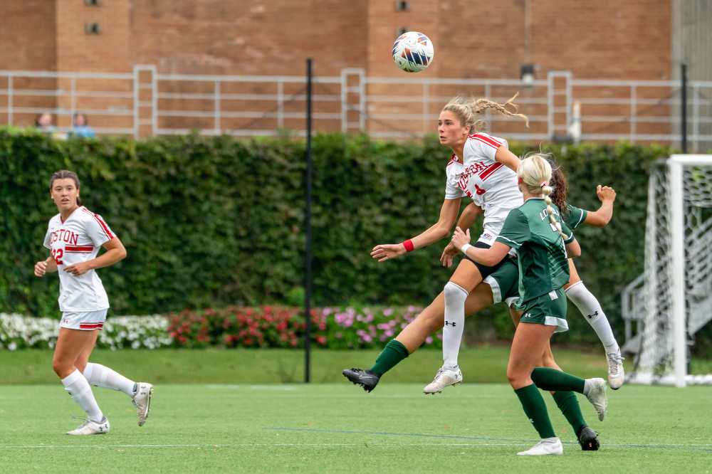 Boston University sophomore midfielder Mackenzie Stickelman (4) hits a header against Loyola University Maryland on Saturday, Sept 16. The Terriers lost to Loyola University Maryland 1-0. HUI-EN LIN/DFP PHOTOGRAPHER