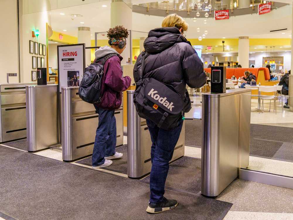 Students walking into Boston University’s Marciano Commons dining hall.
