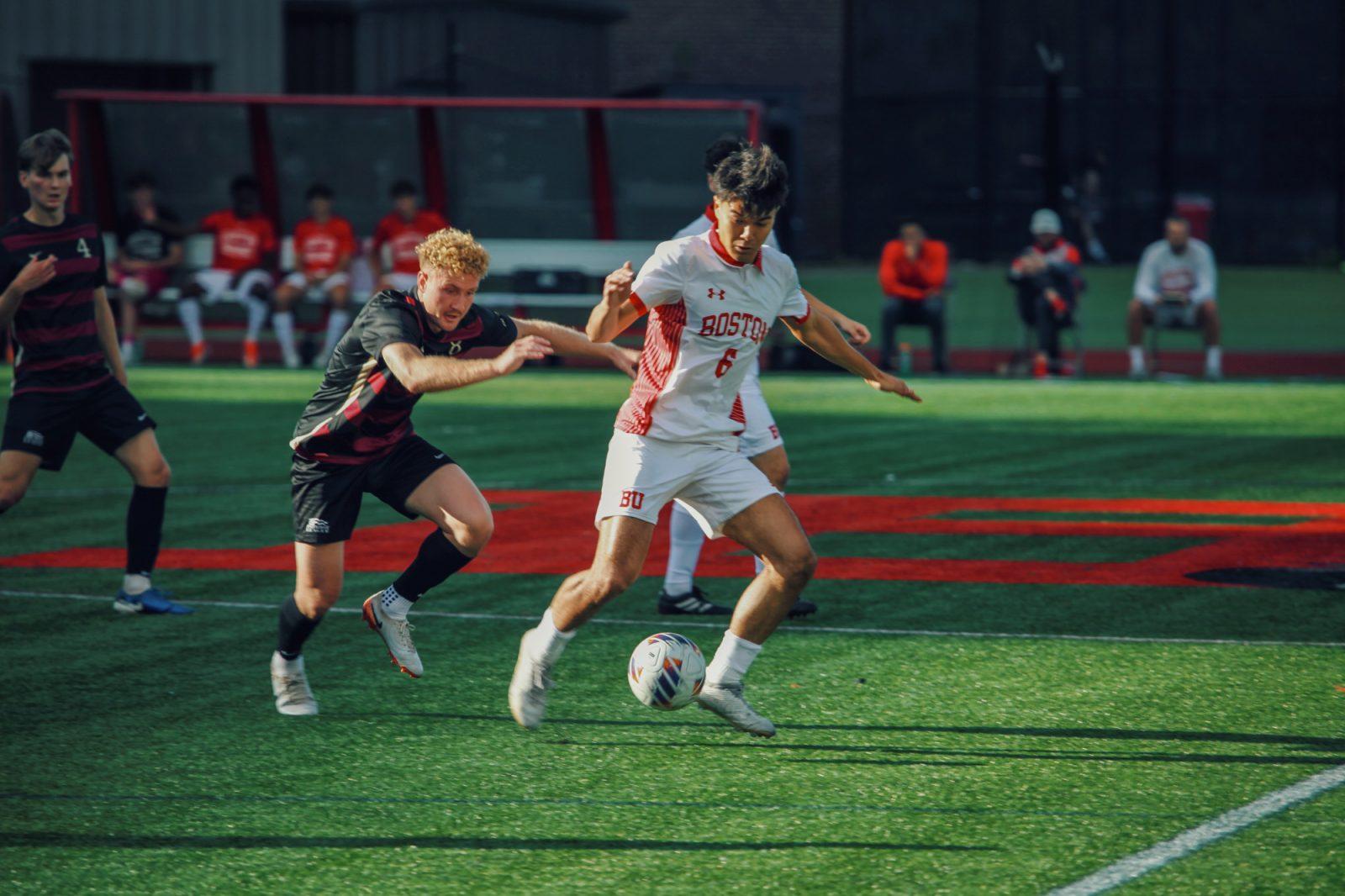Junior midfielder Diego Rived (6) dribbles the ball away from a Lafayette player during the game on Oct. 5. The Boston University men’s soccer team earned their third Patriot League win this season on Saturday. TRACY LIU/DFP PHOTOGRAPHER 