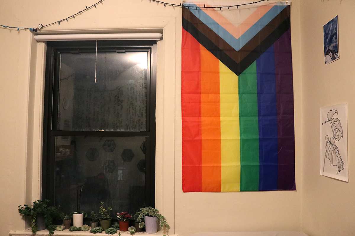A LGBTQ flag hangs on a Boston University student’s wall. A Boston University task force released a report in 2018 with recommendations to make the University safer for its LGBTQ faculty and stuff. Three years later, several of the recommendations have yet to be implemented. LIBBY MCCLELLAND/DFP STAFF
