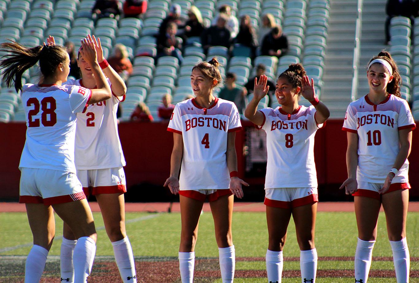 Boston University women’s soccer players high-five during a match against Loyola University Maryland on Oct. 20. The Terriers secured first place in the Patriot League and wrapped their season Wednesday after a 2-1 win over Army West Point. ISABELLE MEGOSH/ DAILY FREE PRESS STAFF
