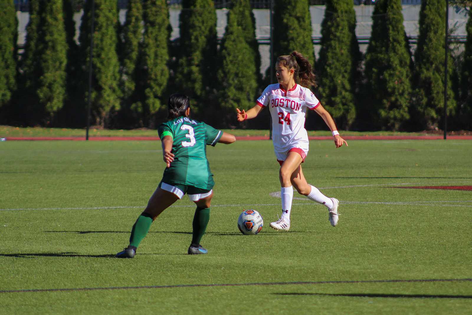 Sophomore midfielder Lily Matthews runs with the ball in a soccer match against Loyola University Maryland. The Terriers tied with the Greyhounds 1-1 Saturday afternoon. ISABELLE MEGOSH/ DAILY FREE PRESS STAFF