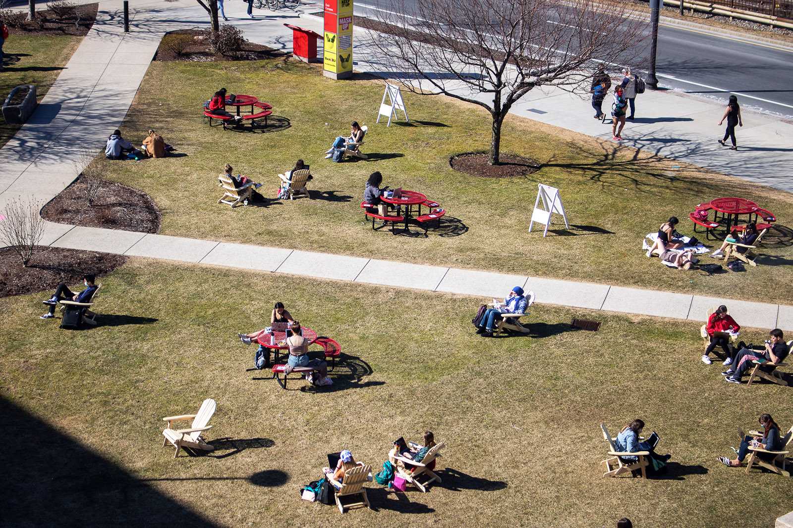 Students sitting on the College of Communication lawn. Frances shares her list of go-to places on and around campus that help ease her anxiety. CAROLYN MOONEY/ DFP FILE