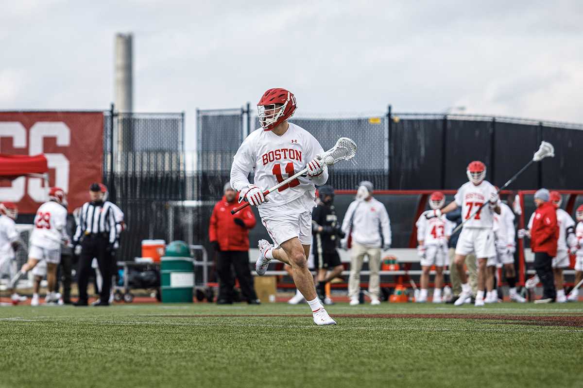 Junior Vince D’Alto during a game against the Bryant University Bulldogs Feb. 19. In its first-ever matchup with UMass Amherst, the Boston University men’s lacrosse team won 16-7 Feb. 26 at Nickerson Field. ELIZA NUESTRO/DFP STAFF
