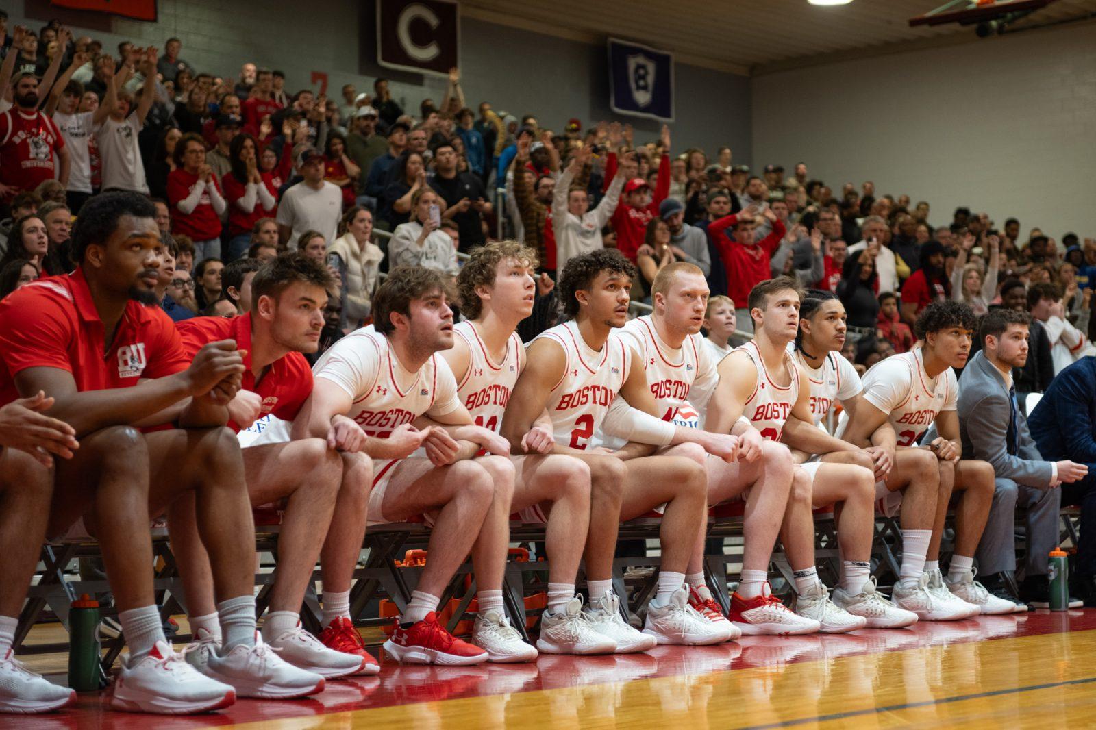Boston University's bench watches senior guard Miles Brewster shoot a free throw to send the Terriers to overtime in the Patriot League semi-final game against Lehigh on Sunday. The Terriers fell to the Mountain Hawks 84-79. MOLLY POTTER/DFP PHOTOGRAPHER