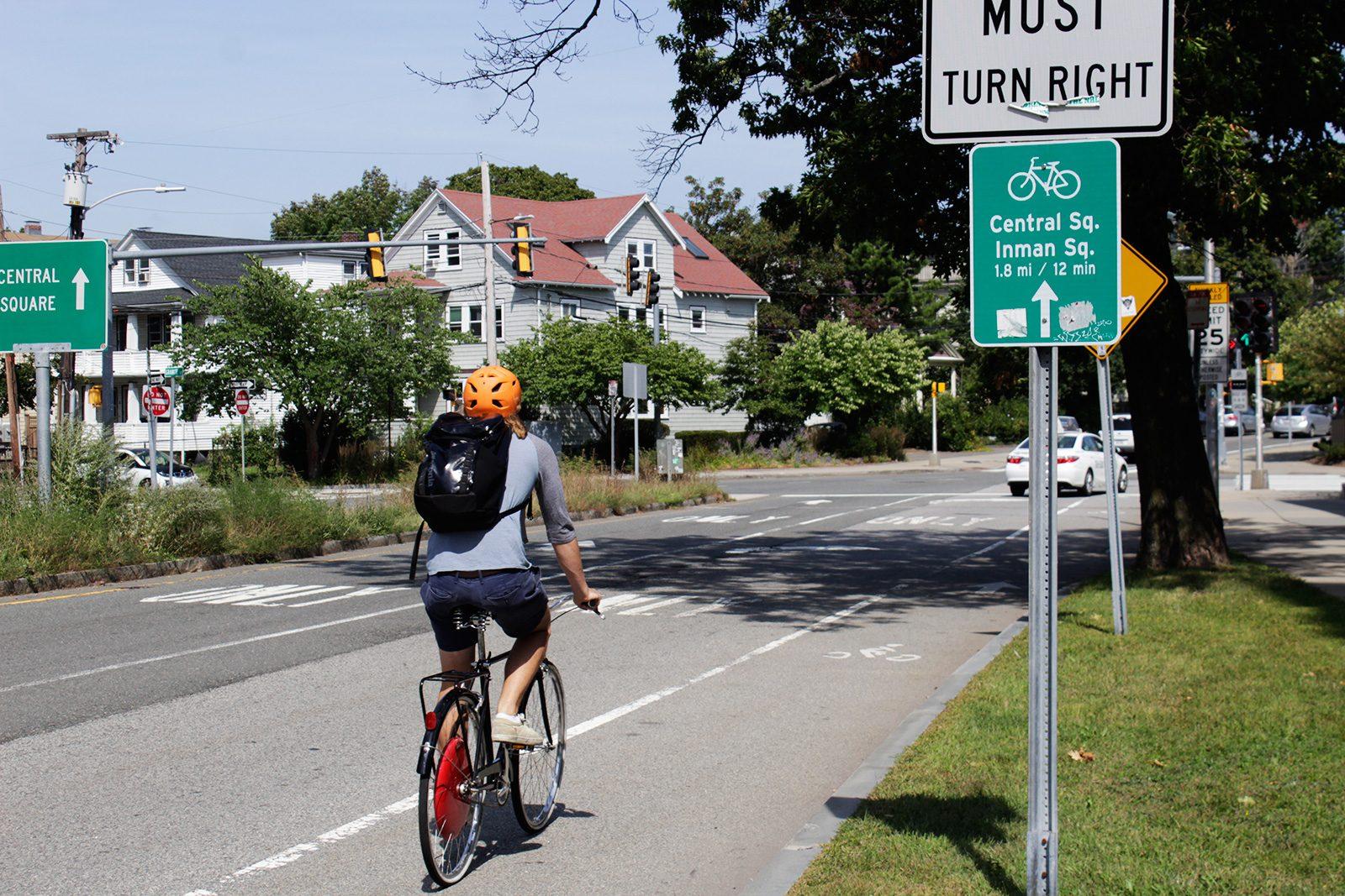 A biker in Cambridge uses the designated bike lane. The Massachusetts Department of Transportation’s “Complete Streets” program funds projects to improve streets in various cities. RACHEL SHARPLES/ DAILY FREE PRESS STAFF