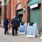 patrons outside the fenway park vaccination site