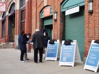 patrons outside the fenway park vaccination site