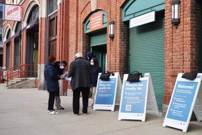 patrons outside the fenway park vaccination site