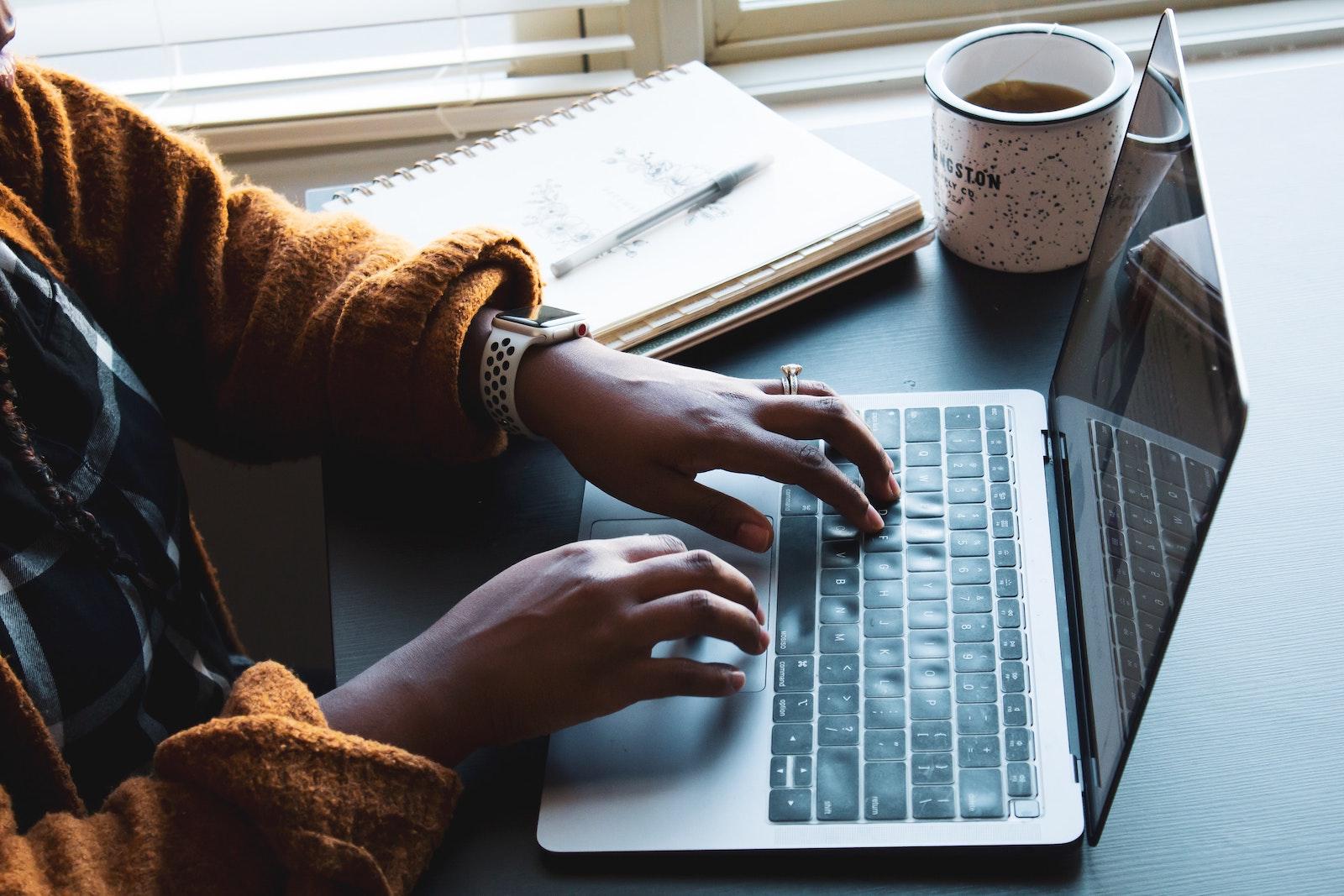 A person working on their laptop. Boston University’s Black Business Student Association organized a panel Thursday with two BU alumni to answer common questions students had about freelancing. COURTESY OF DANIEL THOMAS VIA UNSPLASH