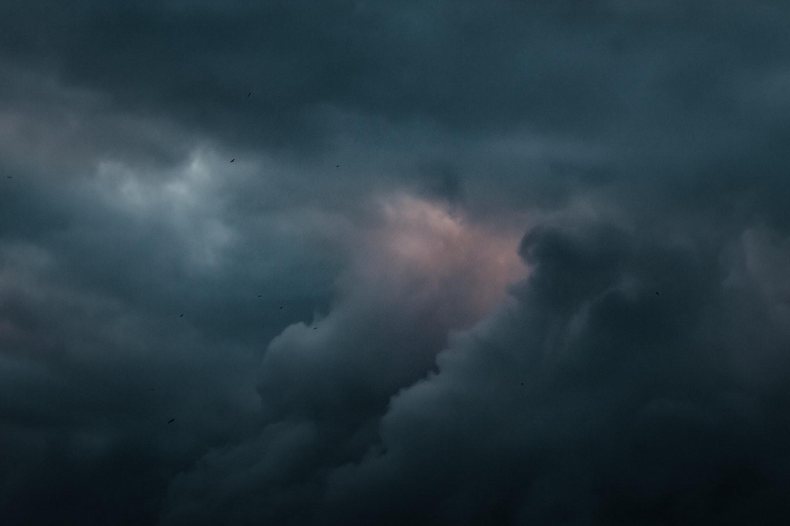 A dark sky. The season of cold, windy weather and waning daylight is upon Boston, during which seasonal affective disorder begins for many people. Payton shares some tips to keep spirits high during this period. COURTESY OF TOLGA AHMETLER VIA UNSPLASH
