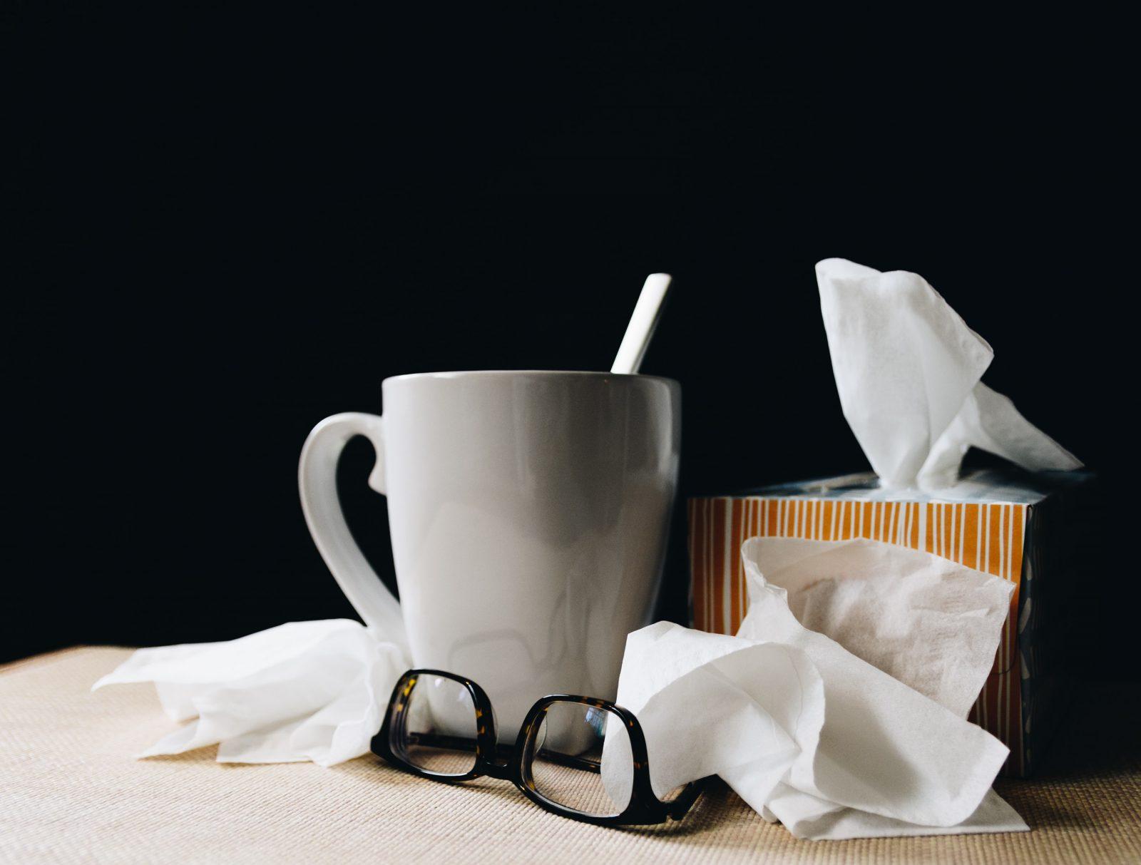 A mug of tea and a tissue box. Mia chronicles her latest sick experience and shares some advice for when college students fall ill. COURTESY OF KELLY SIKKEMA VIA UNSPLASH
