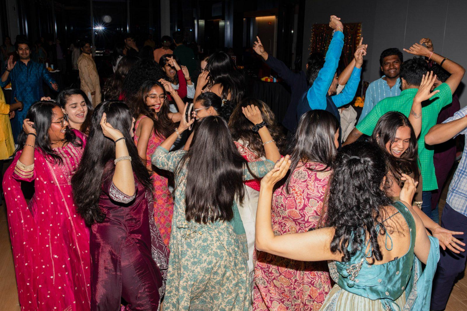 Students dance at a Diwali celebration at the Center for Computing and Data Sciences on Friday. Organizations around Boston, such as the State House and cultural clubs at universities, hosted Diwali celebrations, a five-day celebration observed by people of various Indian religions. SYDNEY ROTH/DFP PHOTOGRAPHER