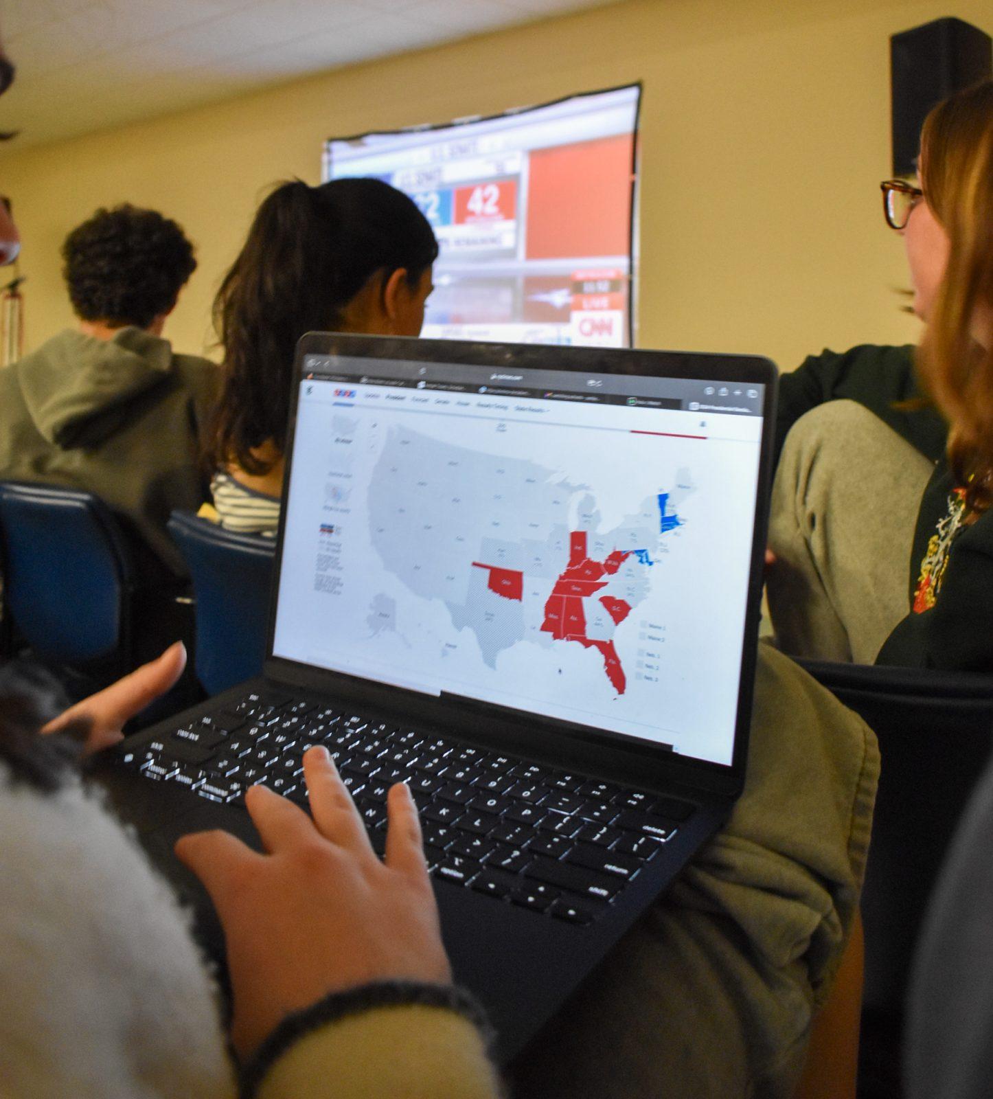 A student looks at the election results at a watch party at Warren Towers on Tuesday. Many Boston University students and faculty expressed concern about the future of their civil and reproductive rights. AVA RUBIN/DFP PHOTOGRAPHER