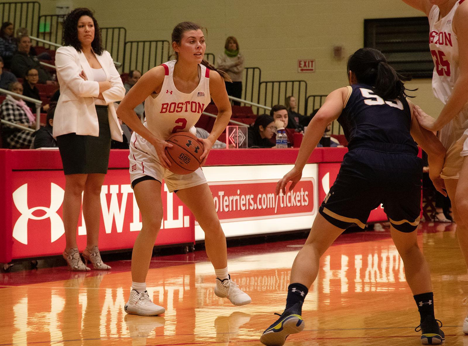 Boston University point guard Katie Nelson in a game against Navy on Feb. 15, 2020. Nelson was a leading scorer in the team’s opening series against the College of the Holy Cross on Monday and Tuesday. RACHEL SHARPLES/ DFP FILE